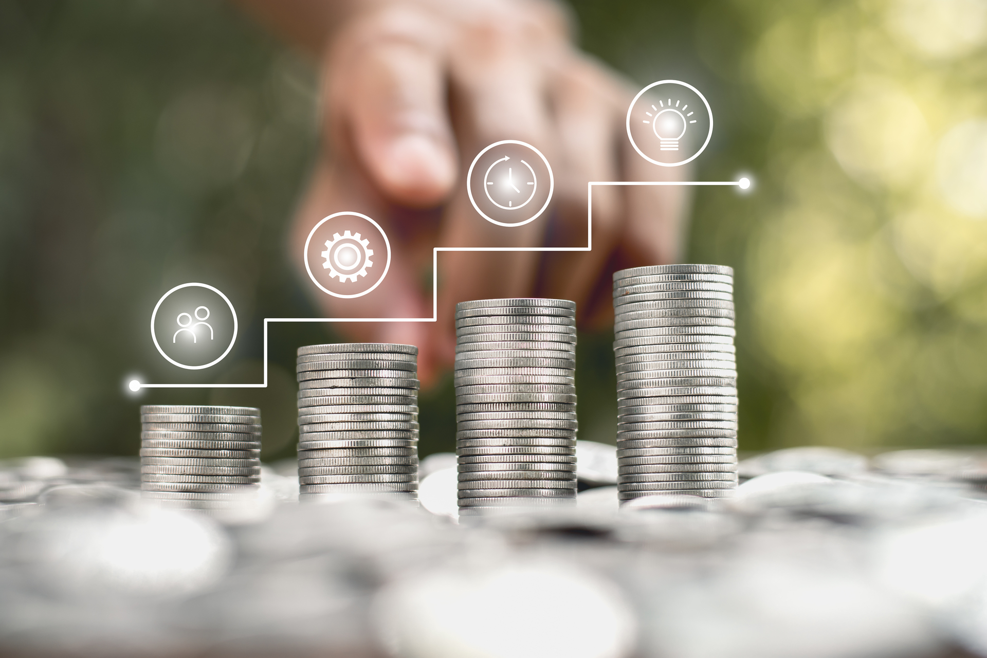Coins stacked four rows with icons on the business growth.